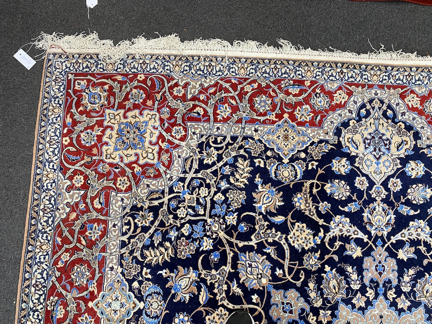 A North West Persian blue ground part silk rug, 220 x 217cm together with a similar smaller red ground rug